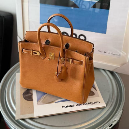 G054 Toffee 1H Togo Leather